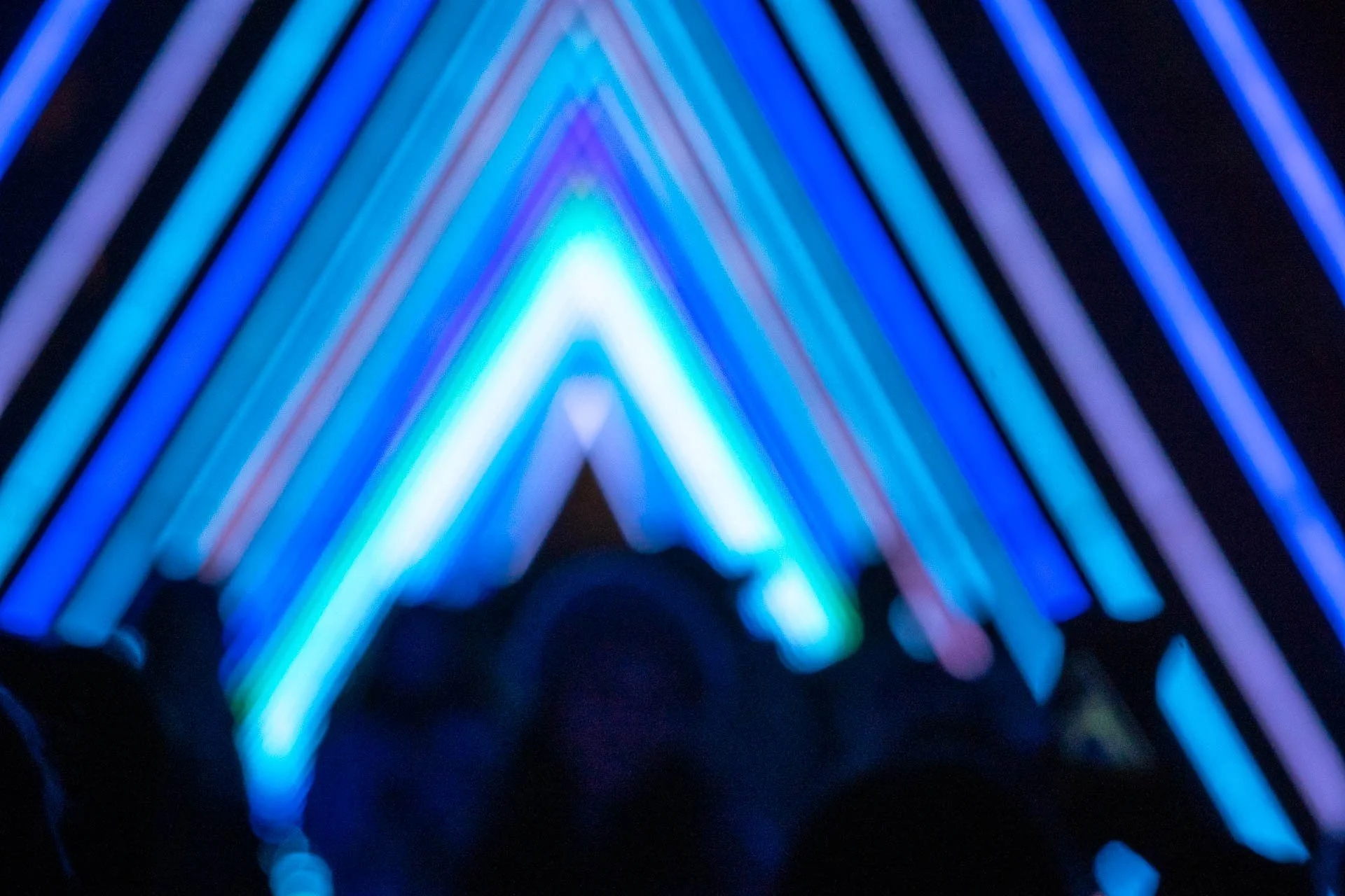 Blue and purple lines of light form a series of triangles during Bright Brussels.