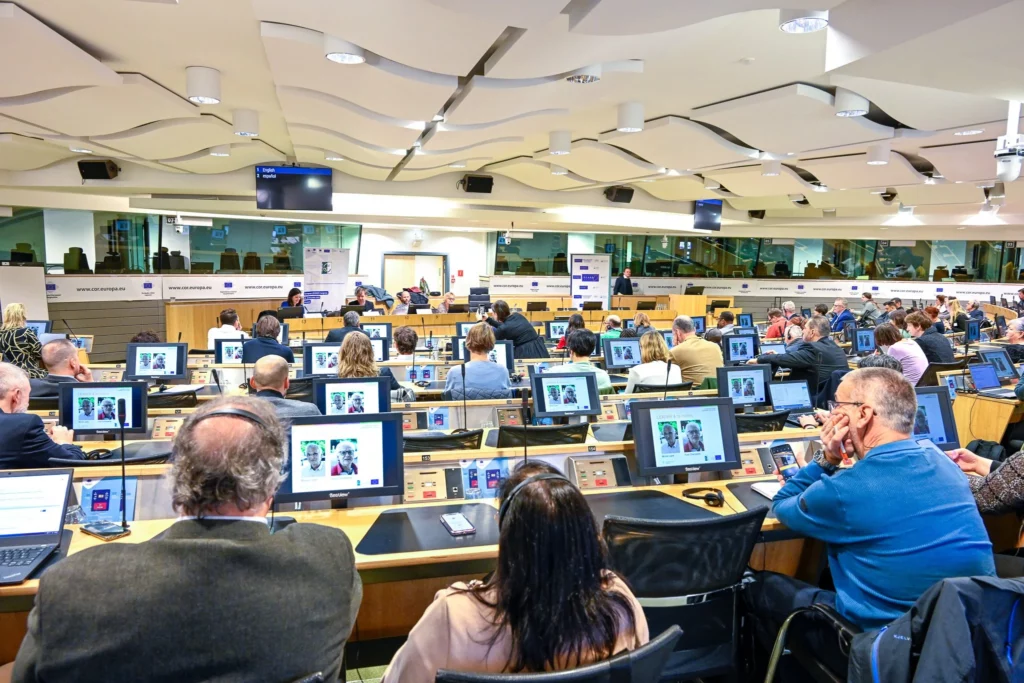 Wide view of participants attending a conference at the EESC in Brussels
