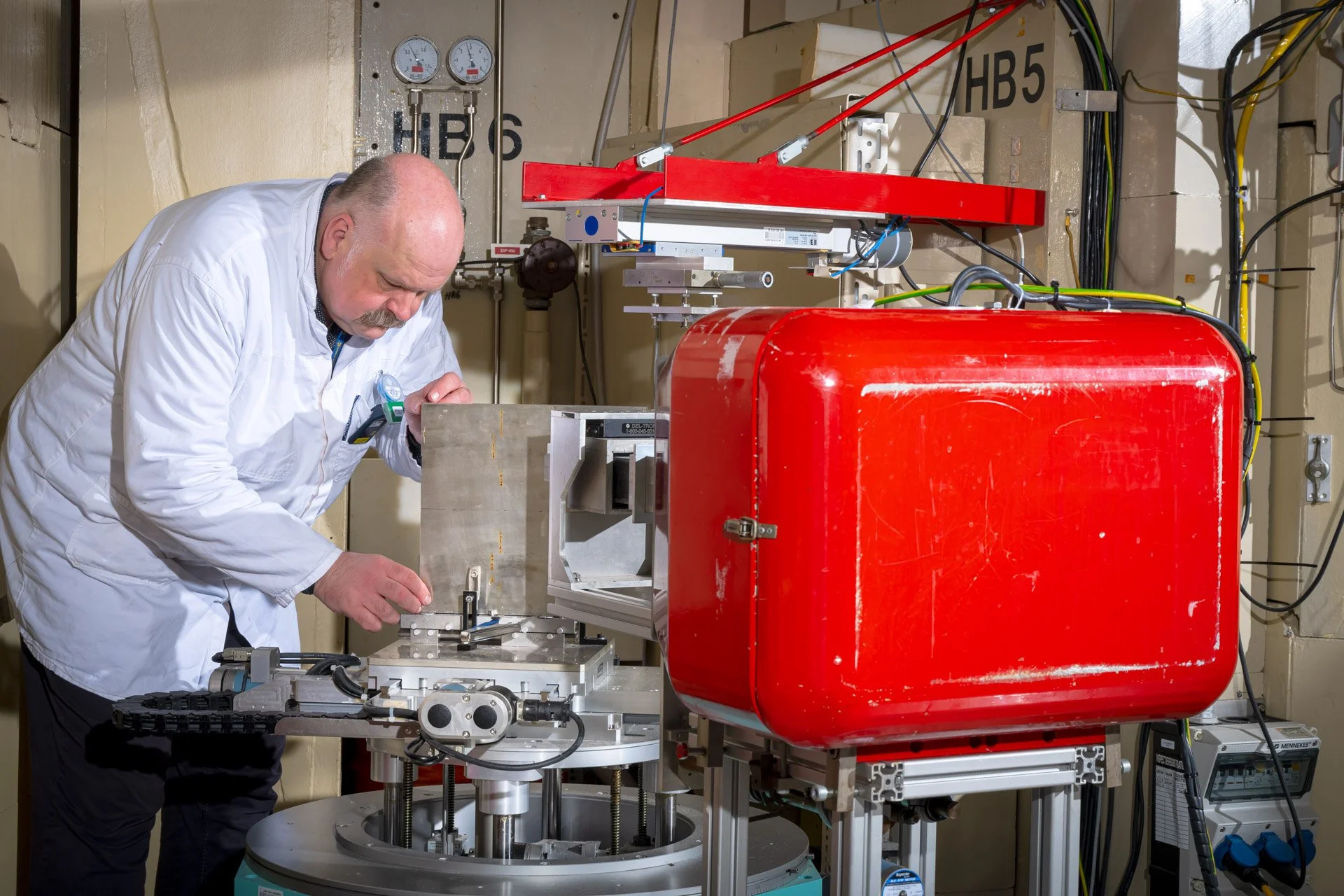 A photograph taken in one of the laboratories, showing a scientist from the JRC in Petten